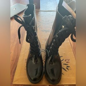 Size 8 black Michael Kors lace up rain boots with thin felt lining.